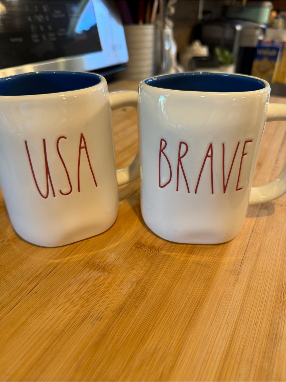 Rae Dunn White Mugs with Blue Interior and Red Lettering - USA & BRAVE
